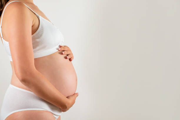 istock Young pregnant female in third trimester. 1261329547