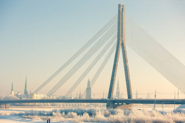 cable-stayed bridge in riga in winter - daugava river imagens e fotografias de stock