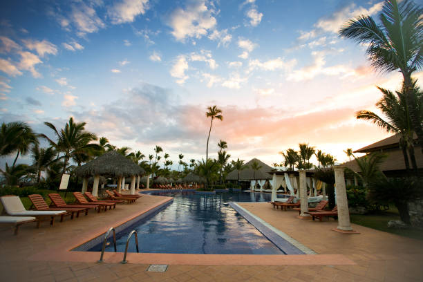 istock swimming pool with sun loungers without tourists. 1261330335
