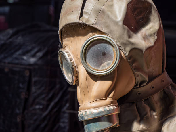 istock old gas mask on black background 1261333121