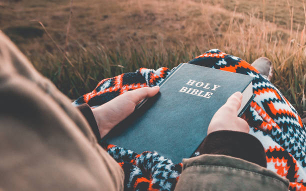istock girl reads the bible 1261339666