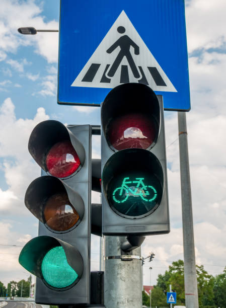 istock Traffic light against blue cloudy sky. Traffic lights for bicycles. 1261344473