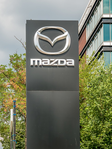 Bucharest/Romania - 07.18.2020: Mazda logo or sign at the entrance of a car dealership in Bucharest.