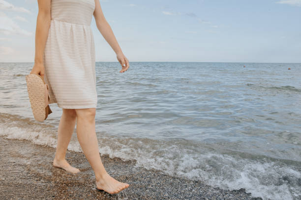istock woman with beach slippers 1261350457