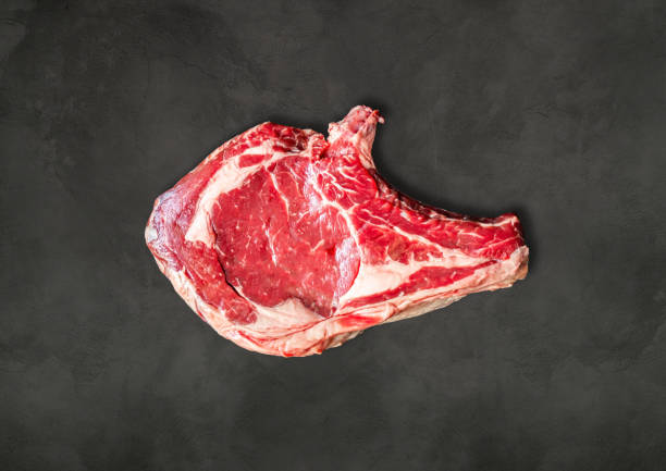 istock Beef prime rib on a concrete background 1261363335
