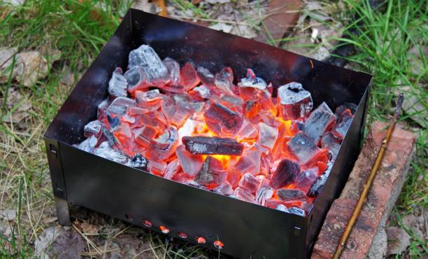 istock Burning coals in the grill. Close up view. 1261363886