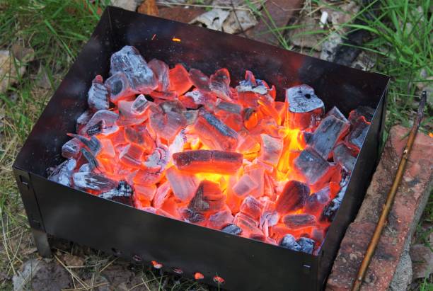 istock Burning coals in the grill. Close up view. 1261363887