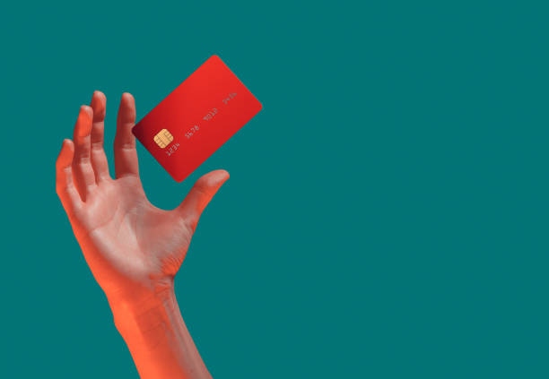 Close up female hand holds levitating template mockup Bank credit card with online service isolated on green background Close up female hand holds levitating template mockup Bank credit card with online service isolated on green background. High quality photo magician money stock pictures, royalty-free photos & images