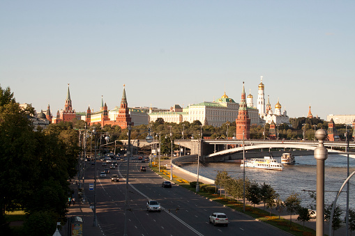 View of one of the most famous buildings of the Russian capital city, with the Moscva river on the right and quite a lot of traffic, by a very clear summer day