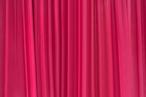 istock red curtain slightly open in the comfortable room for background 1261434096
