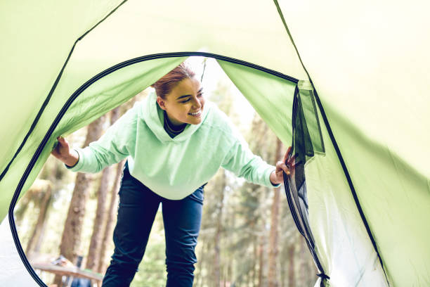 istock Female Entering Camping Tent In Forest 1261444989