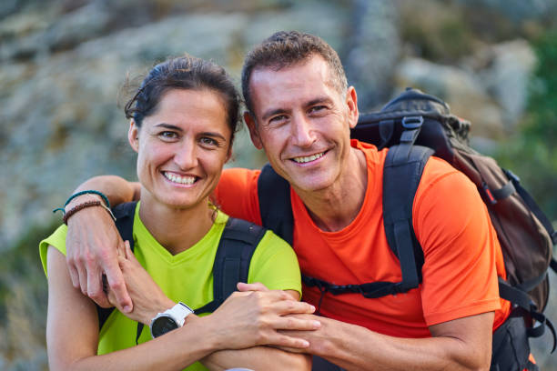 istock Smiling couple standing outside together during a hike 1261447683