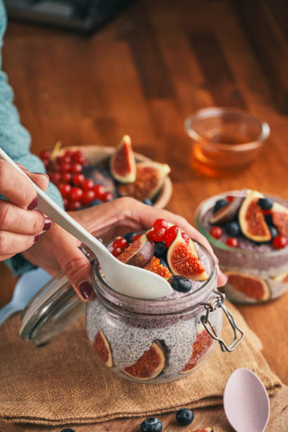 istock Healthy Yogurt with Chia Fresh Figs, Blueberries and Redcurrants 1261448821