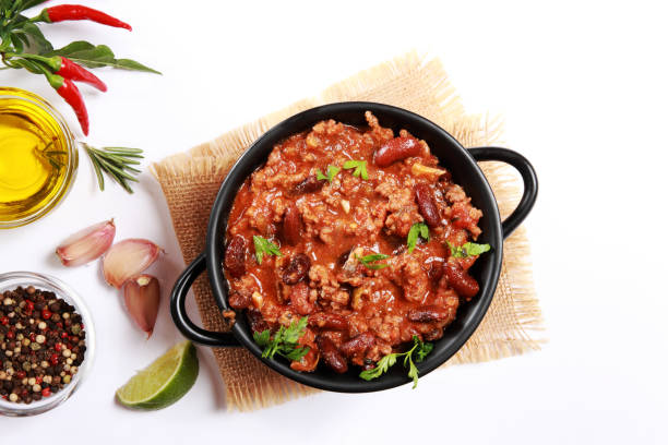 Chilli With Meat Chilli Con Carne with Minced Beef, Kidney Beans, topped with Coriander Leaves on white background chili con carne photos stock pictures, royalty-free photos & images