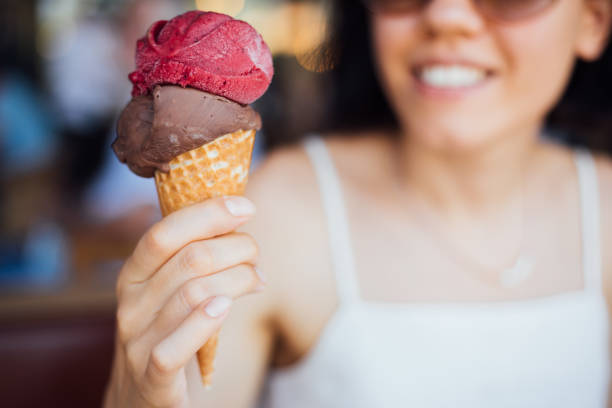 istock Woman eating ice cream 1261463111