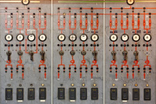 Wall of an old style control room.