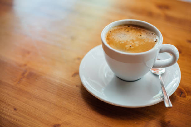 istock Coffee cup on the wooden desk concept 1261466409