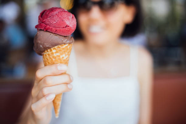 istock Woman eating ice cream 1261467969