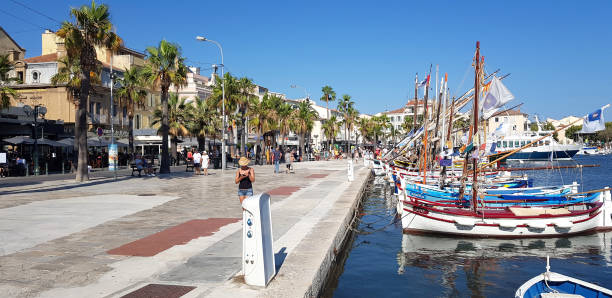 Colorful Porvencal boats in the harbour, Sanary-sur-Mer, France Sanary-sur-Mer, France - 26 July, 2020: Colorful Porvencal boats in the harbour. These boats, also referred to as "pointus", are classified as historical monuments. sailboat mast stock pictures, royalty-free photos & images