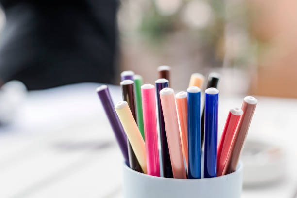 istock a group of colored markers in a plastic container. 1261494478