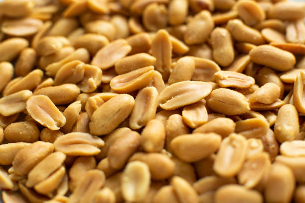 istock Full Frame Close Up Background Shot Of Salted Peanuts 1261497864