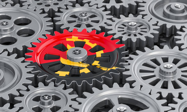 istock Angolan flag on the gearwheel, business industrial concept. 3D rendering 1261505111