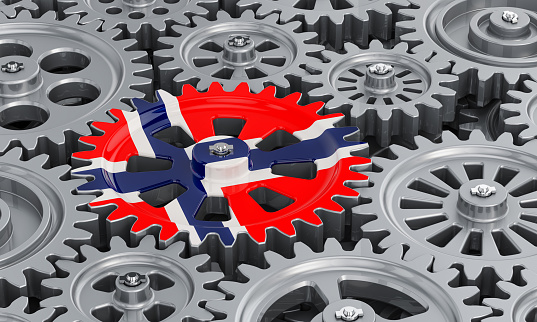 Norwegian flag on the gearwheel, business industrial concept. 3D rendering