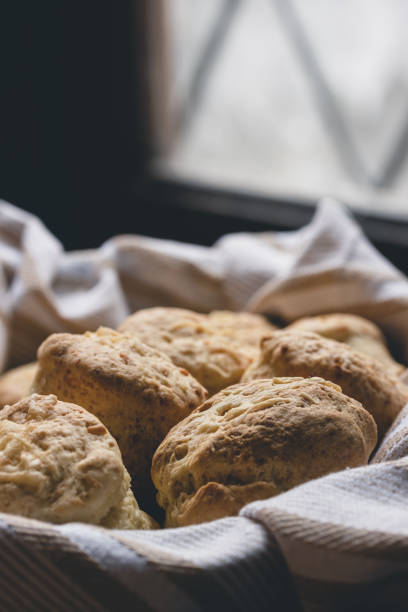 istock Cheese scones in a basket with a cloth napkin. Biscuits. 1261507797