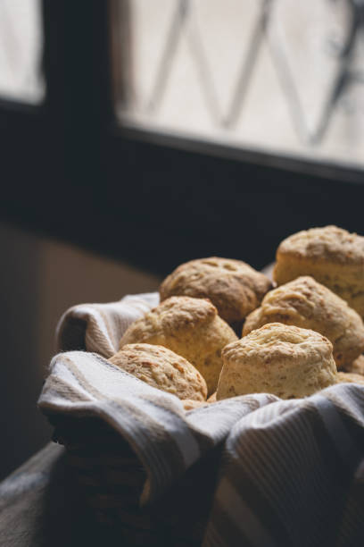 istock Cheese scones in a basket with a cloth napkin. Biscuits. 1261508385