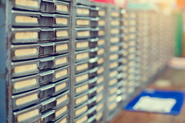 istock Old metal file cabinet. Manual control product system in old warehouse. 1261509309