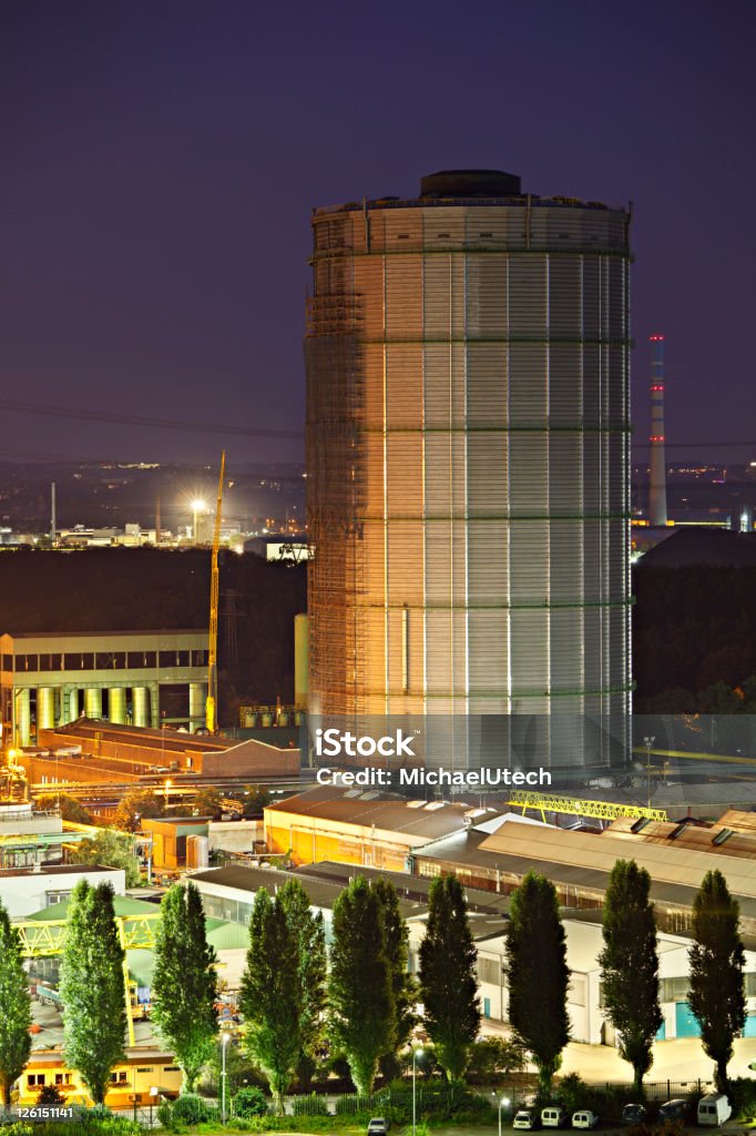 Tall Gasometer At Night  Building Exterior Stock Photo