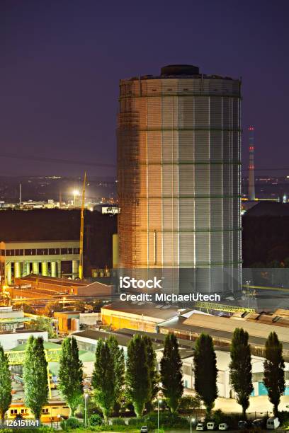 Tall Gasometer At Night Stock Photo - Download Image Now - Building Exterior, Built Structure, Chemical Plant