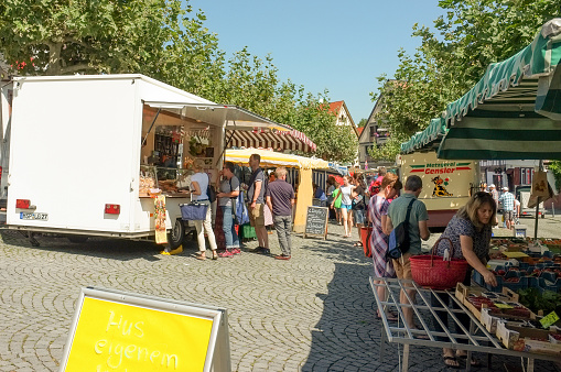 24 August 2019 - Local residents shop on the slope of the Saturday street market in Oberursel in Hesse, Germany.