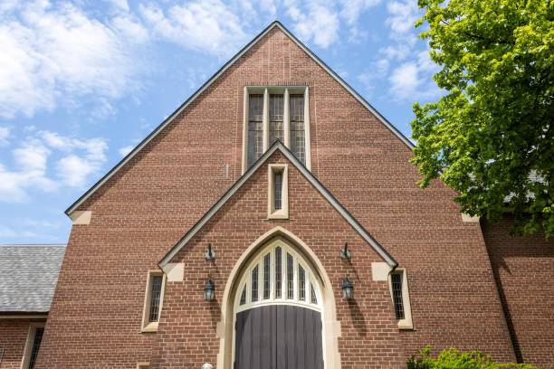 Facade of Presbyterian church with a tree