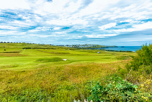 Newquay Golf Course, a links course behind Fistral Beach viewed from a public path towards the surfing beach.