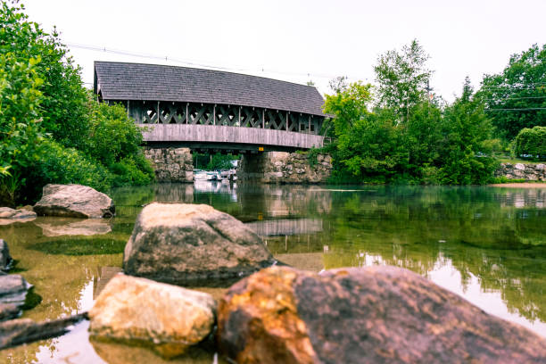 istock Covered bridge over lake in New Hampshire 1261538738