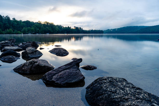 istock Rocks over lake in New Hampshire 1261538764