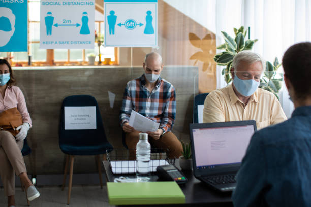 istock Client talking with bank worker at bank office 1261542544