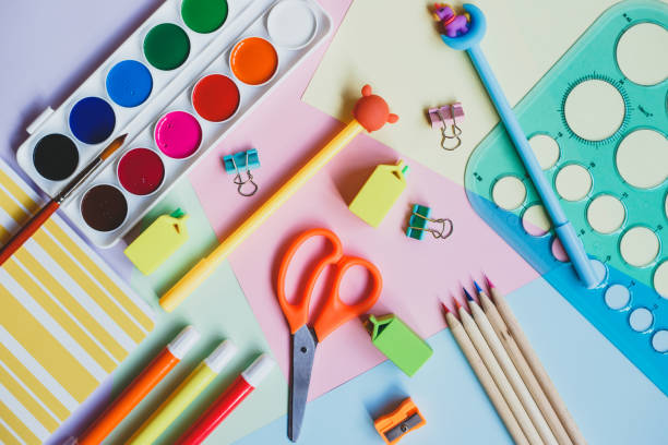 istock Back to school. School supplies on a multicolored background. Top view. 1261550250