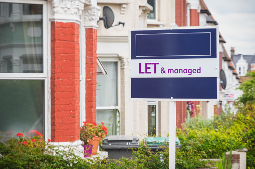 Let and managed sign displayed outside a terraced house in Harringay Ladder area, London, England