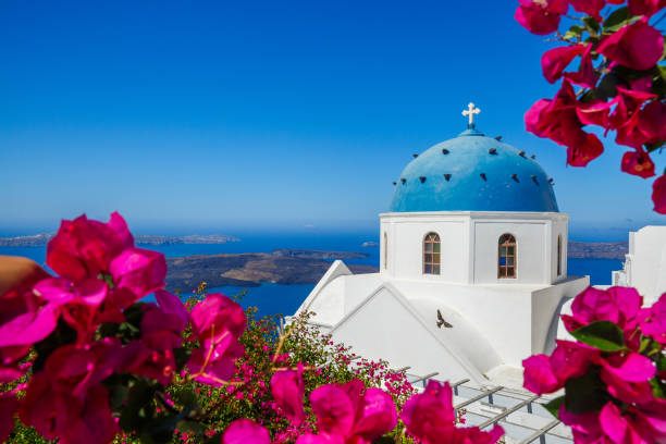 Church of the island of Santorini Church of the island of Santorini on the beach surrounded by blooming bougainvillea greek islands stock pictures, royalty-free photos & images