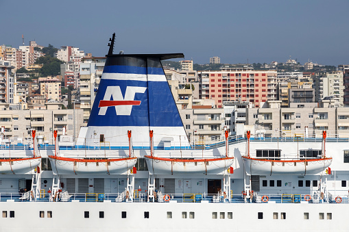 Durres, Albania, July 4 2019: Close up of a chimney of a passenger ferry in the port of Durres with the city in the background