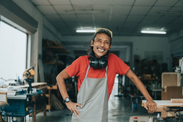 istock Portrait of asian carpenter in his workshop 1261573958