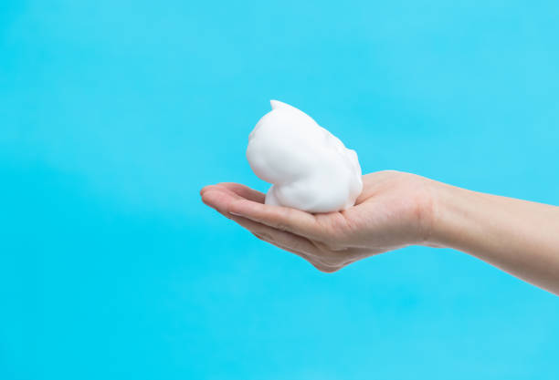 Foam bubble on woman hand.