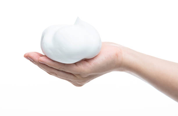 istock Foam bubble on woman hand 1261579649