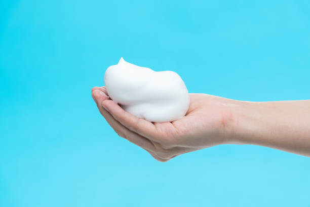 istock Foam bubble on woman hand 1261585002