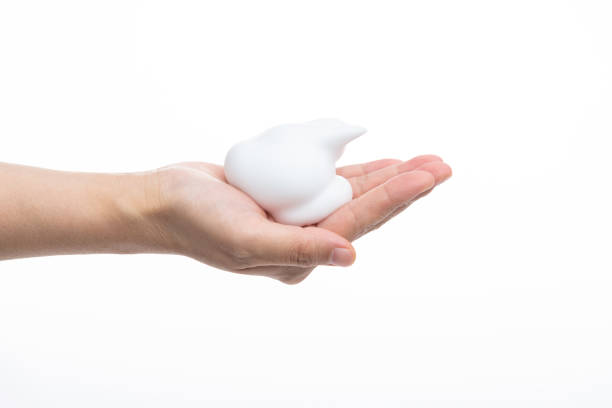 istock Foam bubble on woman hand 1261589825
