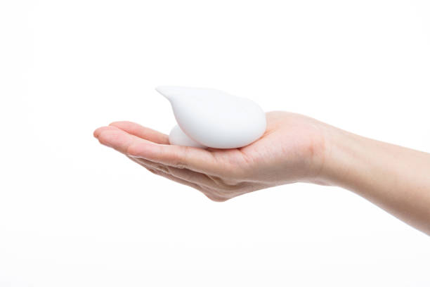 istock Foam bubble on woman hand 1261591036