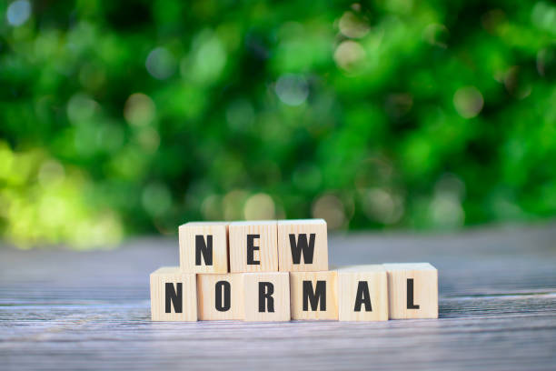 istock Wooden cubes with NEW NORMAL word. 1261592683