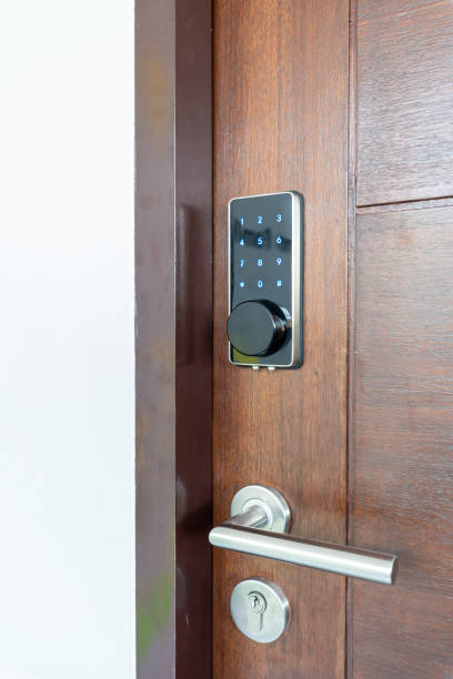 istock Electronic door lock security systems with key pads open by password number. 1261597232